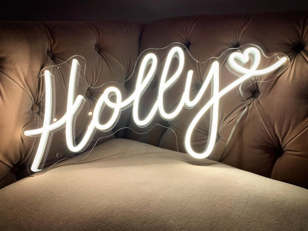 Glowing Holly name neon sign adding a gentle, personalised touch to the room